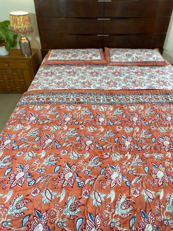 Orange and White Floral Bedsheet and Reversible Quilt Set